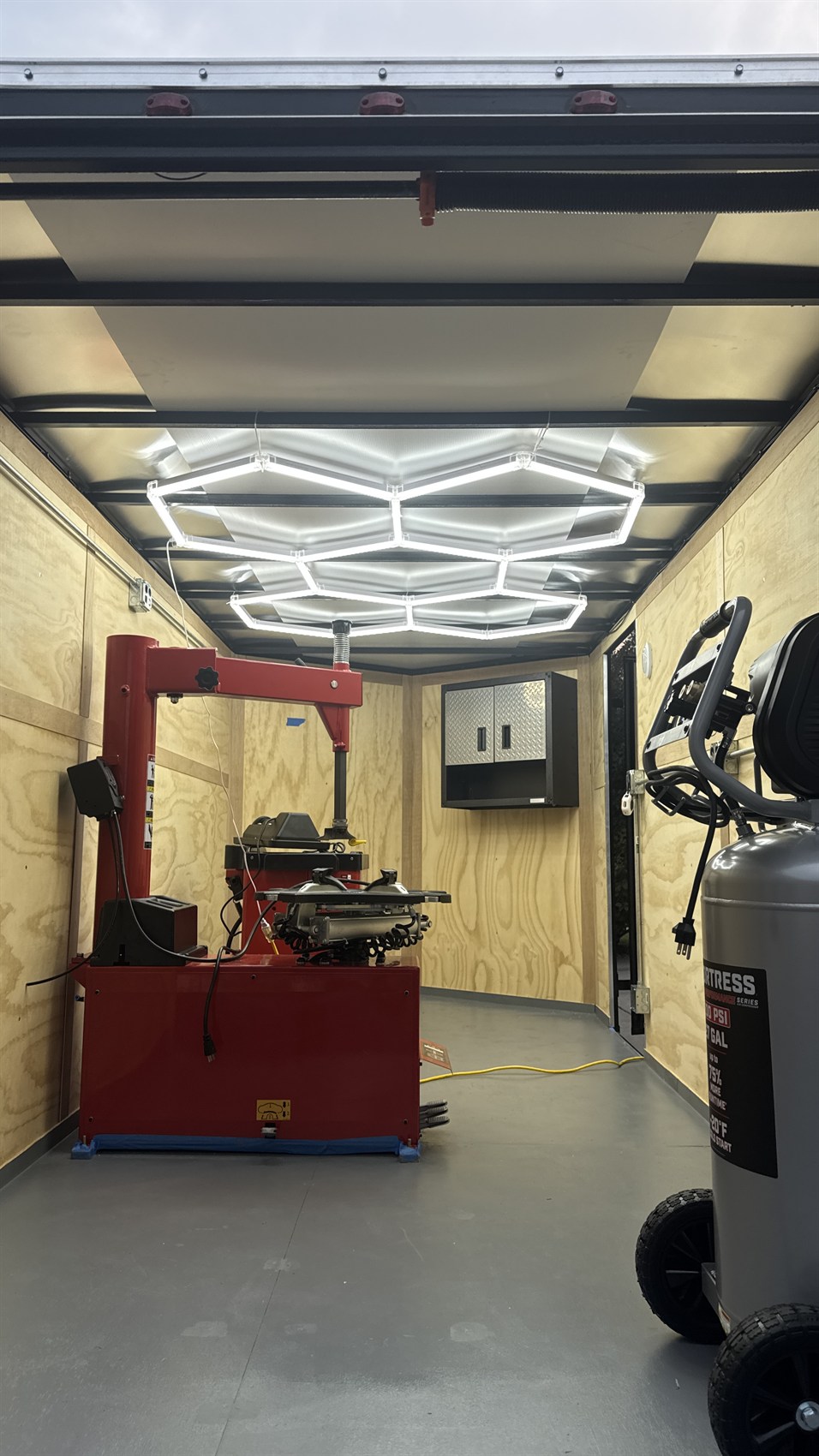 Inside the RollOut trailer: tire changer, lighting and air compressor ready to work
